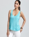 Featuring chevron stripes and a petite patch pocket, this ALTERNATIVE tank is a have-to-have for easy summer dressing.