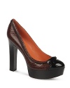 Via Spiga updates these work-friendly platform pumps with patent, contrast cap toes and stylish zipped-up accents.