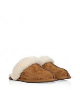 Cozy chestnut slippers from Ugg Australia - These luxe slippers feature supple light brown suede and a comfy lambs wool lining - Stylish seaming down the front with Ugg logo - Stay warm and stylish in these lovely slip-ons