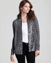 Glam up chilly-weather looks in this C by Bloomingdale's sequin cardigan. A glimmering shawl highlights day or nighttime style.