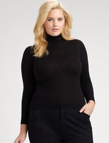 Fine-gauge Merino wool in a classic silhouette.Ribbed collarLong sleevesPullover styleAbout 25½ from shoulder to hemMerino woolDry cleanImported