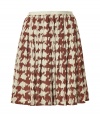 Lady-chic allure gets a cool modern update in Burberry Brits modern houndstooth printed silk skirt - Hidden back zip, allover print, full flared skirt - Pair with soft knit tops and pumps