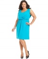 Be the belle of the boardroom in NY Collection's sleeveless plus size dress, accentuated by a cinched waist.