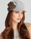 Olive green flowers pop off the light gray background of this cute August Accessories modboy hat.