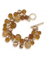 Autumnal allure. Rich golden and amber hues make Carolee's chic cluster bracelet a fashionable option for fall. Made in gold tone mixed metal with a toggle closure, it's embellished with glass accents and sparkling charm details. Approximate length: 8 inches.