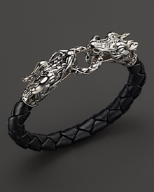 Bold sterling silver dragons link a length of braided leather. From the John Hardy Naga Collection.