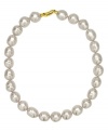 From the island of Mallorca, Spain, this necklace features white baroque organic man-made pearls (14 mm) set in 18k gold over sterling silver. Approximate length: 17 inches.