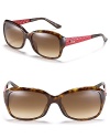 Stylish rectangle sunglasses with red textured temples and signature logo detail.