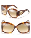 Ultimately chic, these square rounded oversized sunglasses are a must-have accessory for summertime fun.