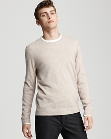 Contrast stitching and stripe trim accent this luxurious crewneck cashmere sweater from John Varvatos.