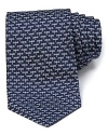 A very fine silk tie with an allover dragonfly pattern adds an artful touch to your wardrobe.