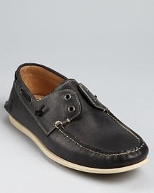 Laceless boat shoe stylings from John Varvatos Star USA, embellished with a moc toe, contrast topstitching and leather linings.