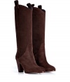 Timeless styling gets a kick of Wild West in Marc by Marc Jacobs tall suede boots, finished with a chunkier cowboy-style heel for that edgy modern feel - Rounded toe, side pull tabs, stacked leather heel - Pull-on style, knee height - Wear with favorite skinnies and chunky knit pullovers, or over opaque tights and edgy modern separates