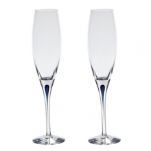 Orrefors Intermezzo Blue Collection designed by Erika Lagerbielke. From the name synonymous with unique and luxurious art glass, Orrefors' Intermezzo Blue has a distinct teardrop of blue in the stem.