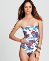 Hit print with this one piece swimsuit from Tommy Bahama. Crafted for maximum figure flattery, it boasts a bandeau top and targeted ruching across the body.