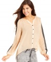 Easy and breezy, Lily White's high-low top boasts chic, colorblocked sleeves and light-as-air chiffon.