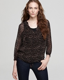 Lend a hint of the exotic to your trans-seasonal wardrobe with this Joie top, emboldened by a wildly chic animal print.