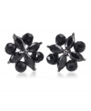 Nothing says simple sophistication more than a pair of stud earrings. This lovely design by Carolee features unique round-cut and marquise-cut jet glass stones. Crafted in hematite-plated mixed metal. Surgical steel posts. Approximate diameter: 5/8 inch.