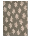 Falling leaves impart jagged-edged style balanced by a solid carbon background. Hand tufted from 100% natural wool, this plush Calvin Klein rug is crafted using the cut-and-loop pile technique that creates a unique matte surface texture.