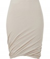 Sumptuously soft and effortlessly elegant, Donna Karans pure, beige cashmere knit skirt epitomizes understated luxury - Curve-hugging, medium-rise pull on style with hidden elasticated waist - Gorgeous signature drape and twist detail at hem - A chic go-to in any wardrobe perfect for pairing with cashmere pullovers, silk tops or button downs and ankle booties or platform pumps