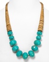 Tribal-inspired chic from RJ Graziano. This bold necklace marries graduated wooden discs with multifaceted turquoise beads for a versatile piece that works with a black dress or dark jeans.