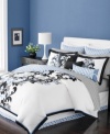 The Damask Flourish duvet cover set from Martha Stewart Collection features a polished floral damask design over smooth cotton percale. On the reverse, the bedskirt and European shams present a geometric latticework in white and blue, adding a repeating contrast to this sophisticated ensemble.