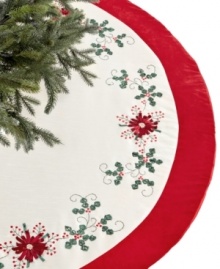 Festive from the ground up. Ribbon poinsettia blossoms stitched in Jabara's red and white tree skirt complement your Christmas tree with crafted elegance.