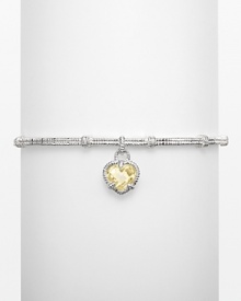 Heart-shaped canary crystal stone on a textured sterling silver linen bangle. Designed by Judith Ripka.