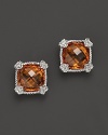 Brilliant honey corundum is framed in sterling silver on these timeless Judith Ripka studs.