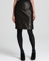 This foundation piece for a season full of lady-chic styles, this Jones New York pencil skirt subtly shimmers with pretty black lace over a metallic underlay.