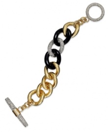 Juicy Couture's stylish toggle bracelet completes an elegant triple play with its blend of gold tone, black epoxy, silver tone and glass-accents. Chain set in gold tone aluminum. Approximate length: 7-1/2 inches.