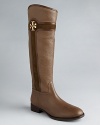 Tory Burch signature logos highlight mixed-media, tonal shafts in riding boots that will end up with lots of mileage.