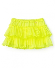 The ultra-light mesh tutu from Juicy Couture easily adds a splash of color and movement to her look.