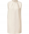 With a pristine shade of ivory silk and retro 60s silhouette, Valentinos modern tailored shift is an immaculate choice for day and evening alike - High-neckline with braided trim and pleat detail, sleeveless, pleated back - Loosely tailored fit, O-silhouette - Wear with flats and stacked up bangles, or with heels and a luxe leather jacket