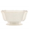 With fanciful beading and a feminine shape, this centerpiece bowl from the Lenox French Perle dinnerware collection has an irresistibly old-fashioned sensibility. Hard-wearing stoneware is dishwasher safe and, in a soft white hue with antiqued trim, a graceful addition to every meal. Qualifies for Rebate