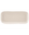 Find stylish versatility in the organic shape and matte-glazed finish of the Casual Luxe hors d'oeuvres tray from Donna Karan by Lenox. Durable stoneware in a soft pearl hue is an ideal host for everyday meals and a natural go-to for entertaining.