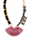 Seal it with a kiss. Betsey Johnson's Kiss Me necklace, crafted from gold-tone mixed metal, features black and fuchsia glass accents, as well as black ribbon and stones, to make an affectionate statement. Approximate length: 19 inches + 3-inch extender. Approximate drop: 2 inches.