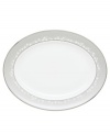 To entertain with grace and style look no further than this Bellina oval platter from Lenox's dinnerware and dishes collection. Elegant bone china with a delicate floral design and textured white beads is finished with platinum trim. Platter shown back. Qualifies for Rebate