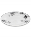 Compose a striking arrangement with the Black Orchid oval platter by Michael Aram. Fine white Limoges porcelain flourishes under a dark watercolor motif inspired by foliage from around the world.