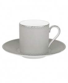 Enjoy a bold brew with this enormously stylish espresso cup and saucer set. From innovative designer Monique Lhullier, it features a platinum-edged tiered scallop pattern on creamy white.