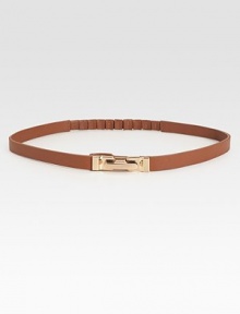 Waist defining and beyond chic, this leather skinny belt is flawlessly complemented by a brass buckle.Brass buckleLeatherLength, 27Width, ½Imported