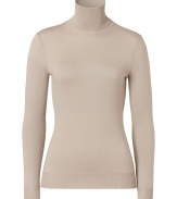 Luxe basics anchor any modern wardrobe, and Ralph Laurens sand-hued merino wool pullover proves an elegant indispensable - Fitted, feminine cut tapers through waist - Long sleeves and turtleneck collar - Finely ribbed trim at cuffs and hem - Versatile and polished, seamlessly goes from work to weekend - Pair with everything from pencil skirts and suit trousers to skinny denim and leather pants