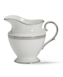 Metropolitan sensibility and modern design combine in this understated white bone china creamer from Lenox's collection of dinnerware and dishes. Platinum gild along the edge is enhanced by a clean, platinum geometric pattern reminiscent of architectural accents. Qualifies for Rebate