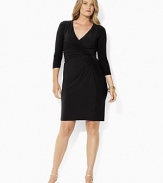 Shirring at one side creates a sleek, flattering silhouette on a dress that's rendered in smooth matte jersey for a look of smart sophistication.