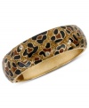 Animal magnetism. Betsey Johnson's hinged bangle bracelet features a brown leopard design with small crystal accents. Crafted in antiqued gold tone mixed metal. Approximate length: 8 inches. Approximate diameter: 2-3/8 inches.