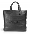 Luxurious bag in black leather - classic and currently very hip shopper shape - very comfortable handles with decorative arrow finish - embossed Loewe logo adds a stylish finish - a genuine favorite, robust and functional - super size, fits a laptop, too