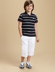 Fresh stripes on smooth jersey, with color tipping at the cuffs and the Armani name under the collar.Ribbed polo collar with contrast lining and logoButton placketShort sleeves with ribbed color-tipped cuffsEmbroidered chest logoEven hem with side ventsCottonMachine washImported Please note: Number of buttons may vary depending on size ordered. 