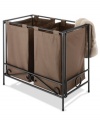 In a class of its own, this laundry sorter adds a touch of sophistication to an everyday routine. Crafted from durable wrought iron, this double hamper makes sorting your colors and your whites look good. The folding design and velcro-looped brown laundry bags are perfect for easy storage and quick convenience. 1-year warranty.