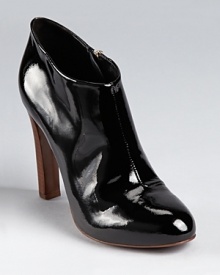 Slick patent leather takes form in an oh-so-classic Tory Burch bootie.