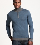 Casual style goes luxe in a mockneck teal sweater from BOSS Black. A half-zip neckline and contrasting collar and cuffs add a sporty accent.